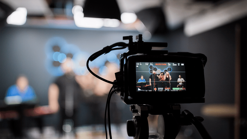  A camera films a band creating royalty free music for Vimeo.